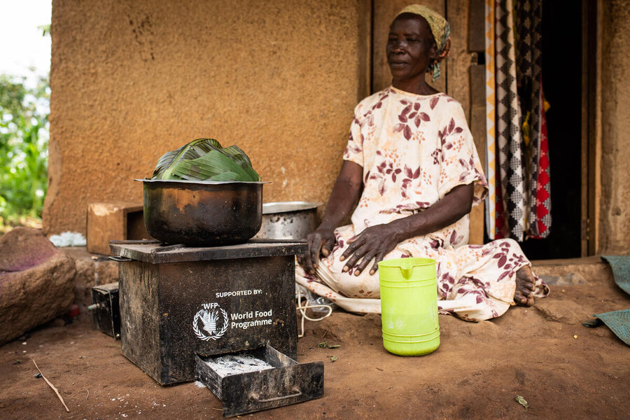 Nyomon, a refugee from South Sudan cooks a meal at the Kyangwali refugee camp. PhotoWFP/Arete/Kibuuka Mukisa